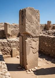 The monumental T-shaped pillars of Göbekli Tepe, featuring intricate animal reliefs.
