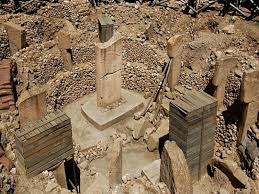 The monumental T-shaped pillars of Göbekli Tepe, featuring intricate animal reliefs.